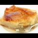 Няма по-вкусна от гръцката млечна баница - цялата пълна с пухкав крем и напоена със сочен сироп: